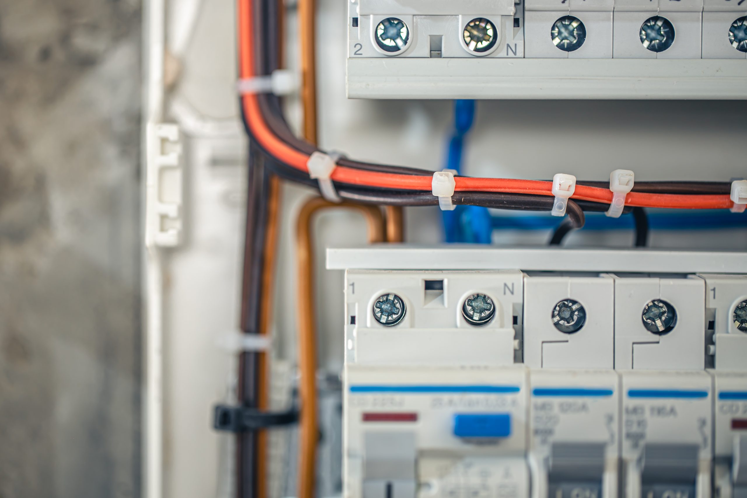 Voltage distributor with automatic switches. Electrical background.